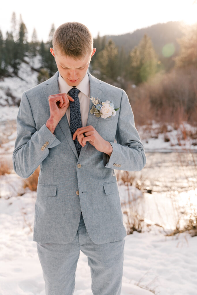 Groom at Beautiful Snowy Couples Session